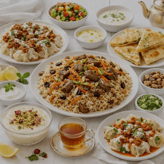 Vegan Afghan platter with Qabuli Pulao, spinach Sabzi, Borani Banjan eggplant, and fresh Afghan bread